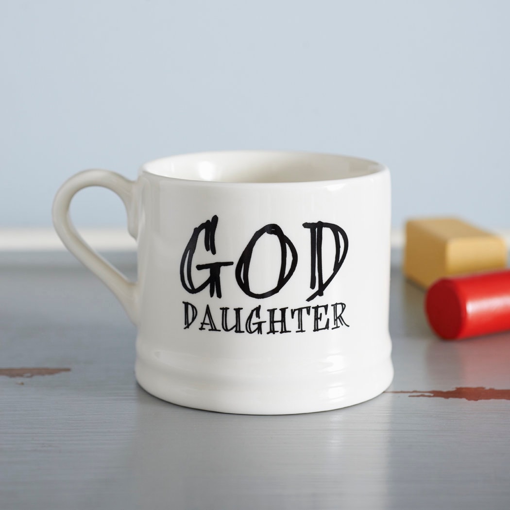 Ceramic “God Daughter” mug photographed beside colourful toy blocks, a thoughtful gift for a goddaughter