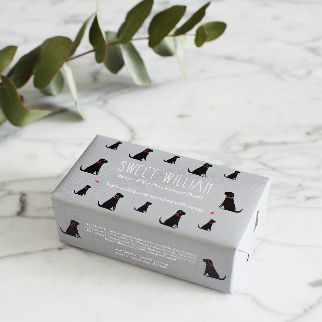 Black Labrador triple milled soap on marble surface — honey-enriched luxury soap in Black Labrador illustrated packaging by Sweet William Designs