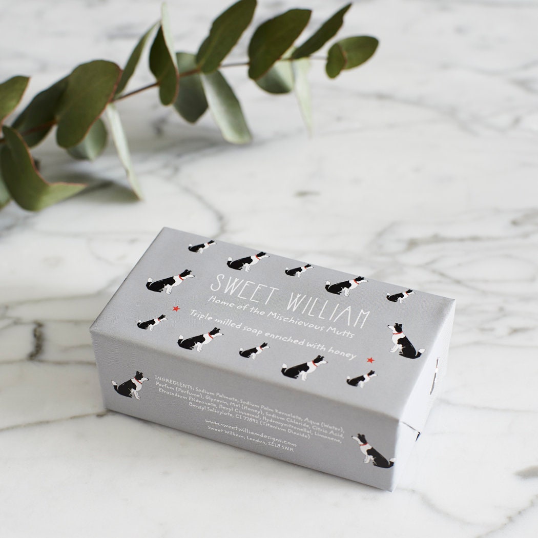 Border Collie triple milled soap on marble surface — honey-enriched luxury soap in Border Collie illustrated packaging by Sweet William Designs