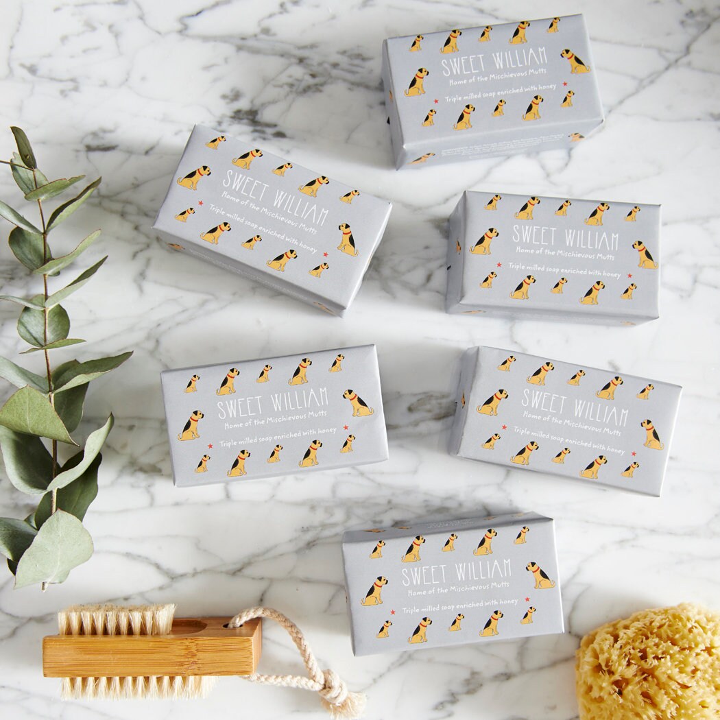 Collection of Border Terrier triple milled soaps on marble surface — honey-enriched luxury dog lover gift by Sweet William Designs