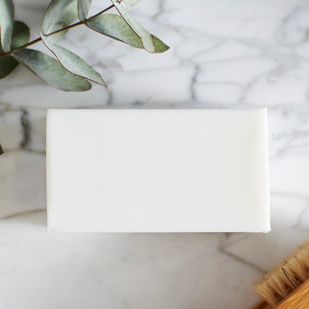 Unwrapped Chocolate Cockapoo / Labradoodle triple milled soap bar on marble surface — honey-enriched luxury soap, no SLS or parabens, made in England