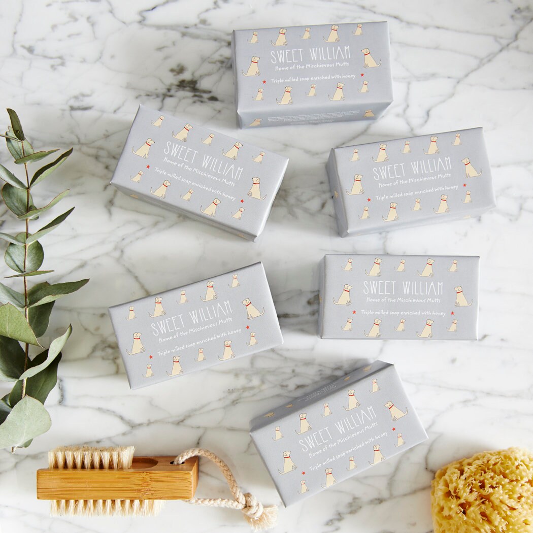 Collection of Yellow Labrador triple milled soaps on marble surface — honey-enriched luxury dog lover gift by Sweet William Designs