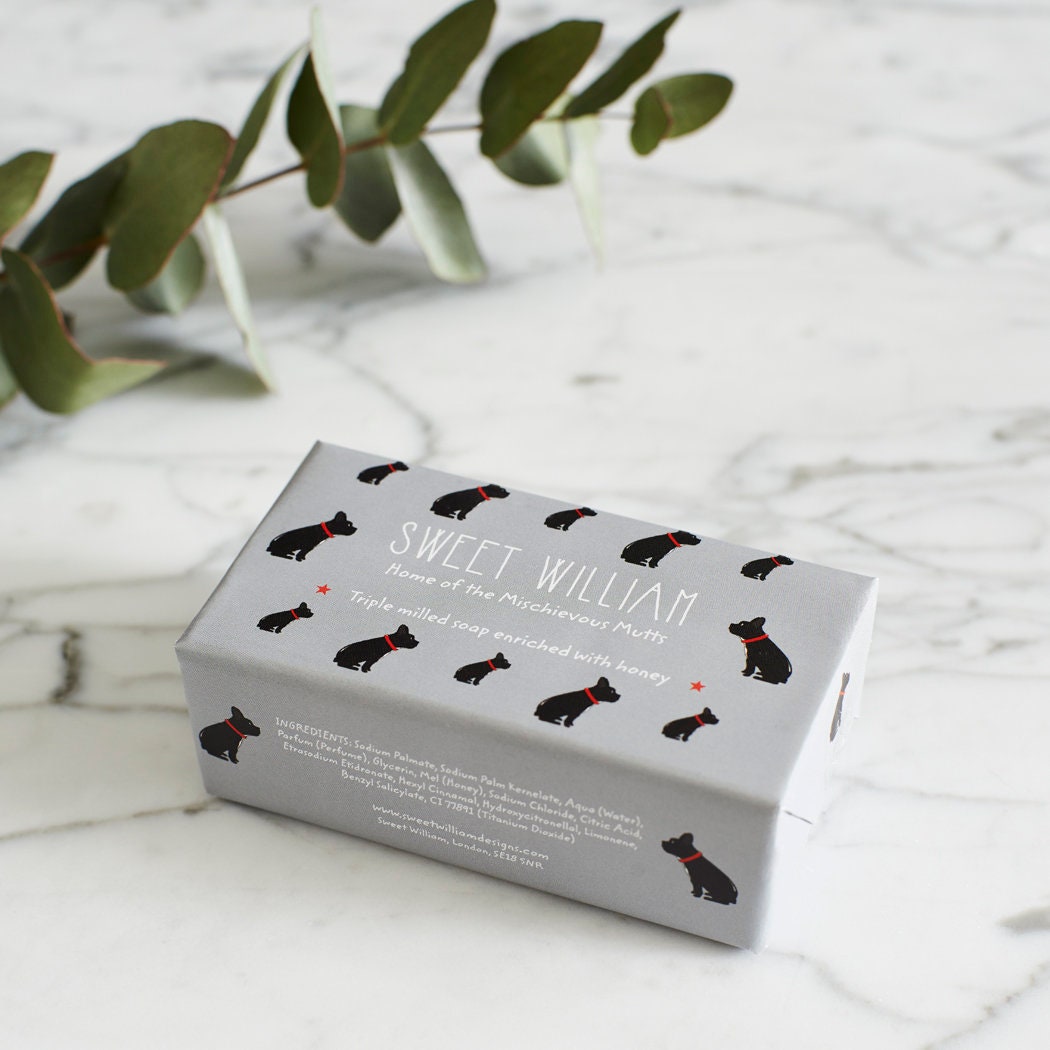 French Bulldog triple milled soap on marble surface — honey-enriched luxury soap in French Bulldog illustrated packaging by Sweet William Designs