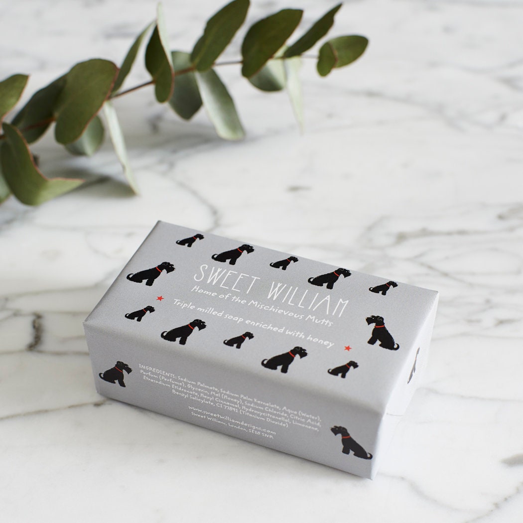 Black Schnauzer triple milled soap on marble surface — honey-enriched luxury soap in Black Schnauzer illustrated packaging by Sweet William Designs