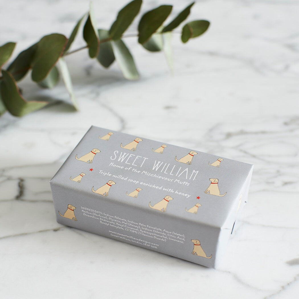 Yellow Labrador triple milled soap on marble surface — honey-enriched luxury soap in Yellow Labrador illustrated packaging by Sweet William Designs