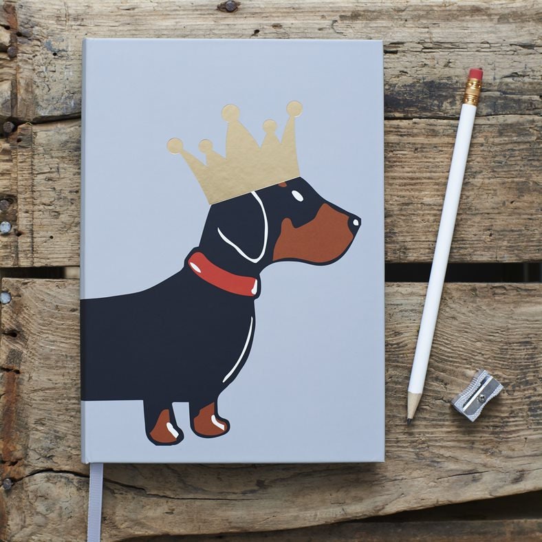 Close-up of Dachshund notebook cover — illustrated sausage dog with gold foil crown, dog lover gift by Sweet William Designs
