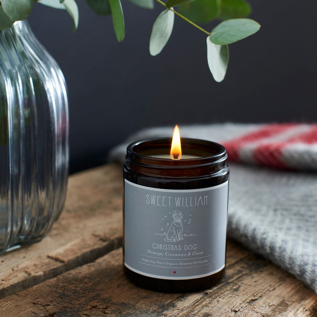 Lit Christmas Dog soy wax candle in amber jar — orange, cinnamon and clove scented, cosy dog lover Christmas gift by Sweet William Designs