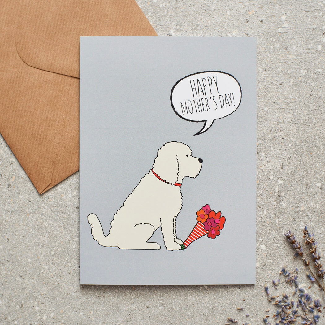 Cockapoo / Labradoodle (Apricot) Mother's Day card featuring illustrated Apricot Cockapoo holding flowers — blank inside, supplied with kraft envelope, by Sweet William Designs