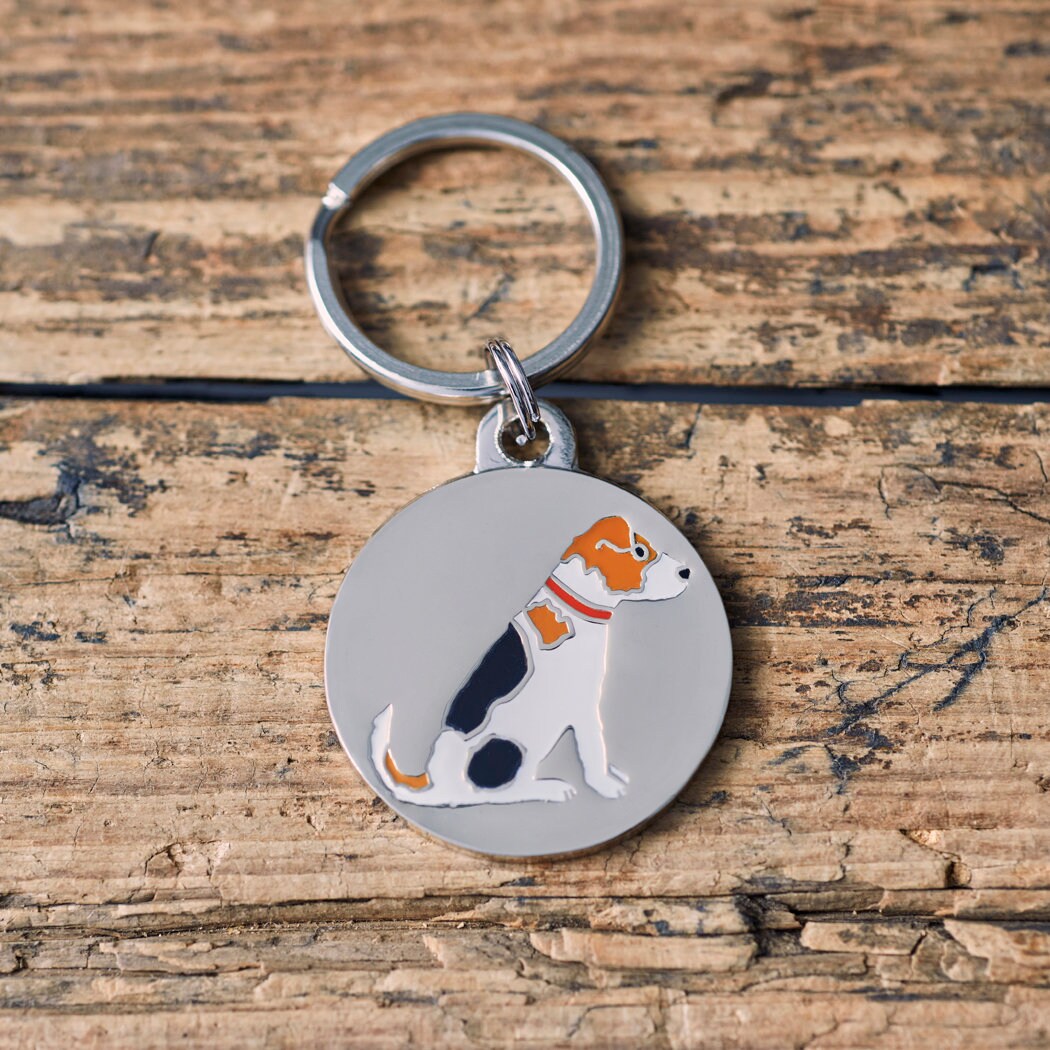 Close-up of Jack Russell dog ID tag — silver-plated brass with illustrated Jack Russell design, personalised dog tag by Sweet William Designs