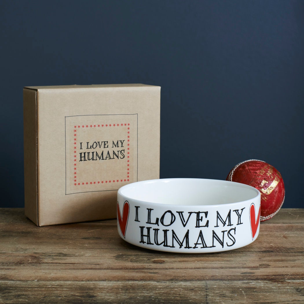 'I Love My Humans' ceramic dog bowl with its matching kraft gift box and a red ball — slogan dog bowl, dog lover gift by Sweet William Designs
