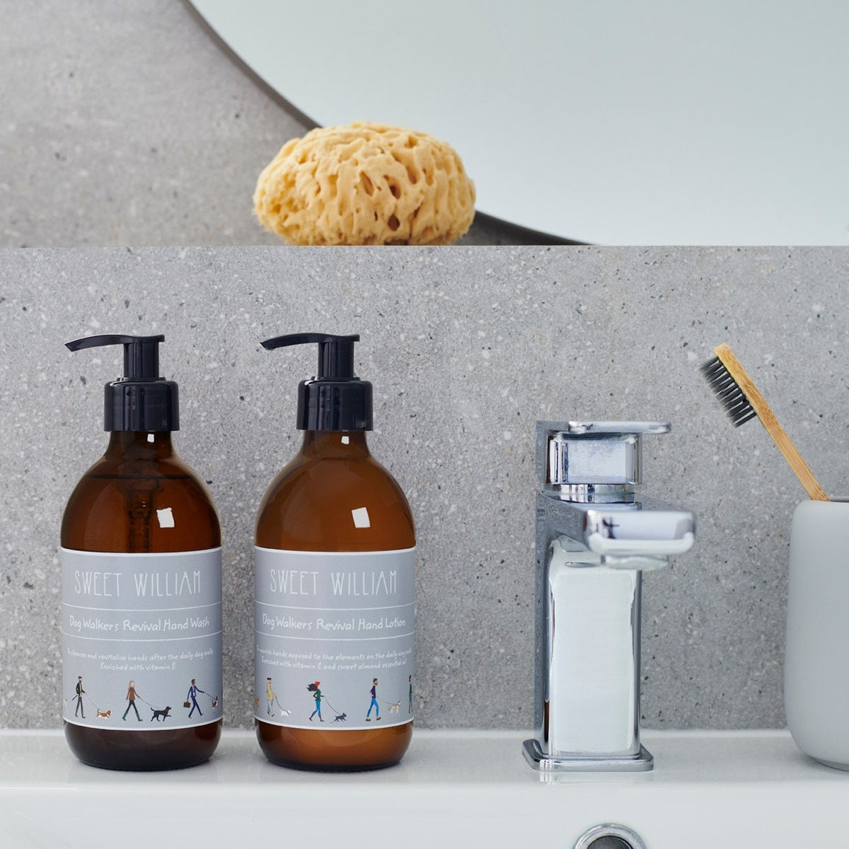 Dog Walkers Revival Hand Wash and Hand Lotion on bathroom shelf with tap and natural sponge — vegan hand care gift set for dog walkers by Sweet William Designs