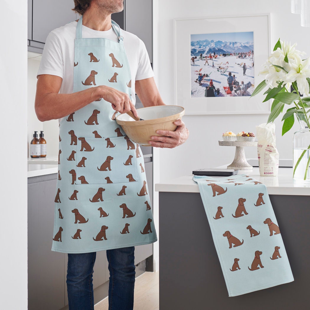 Chocolate Cocker Spaniel apron laid flat — organic cotton dog lover gift, one size fits all.