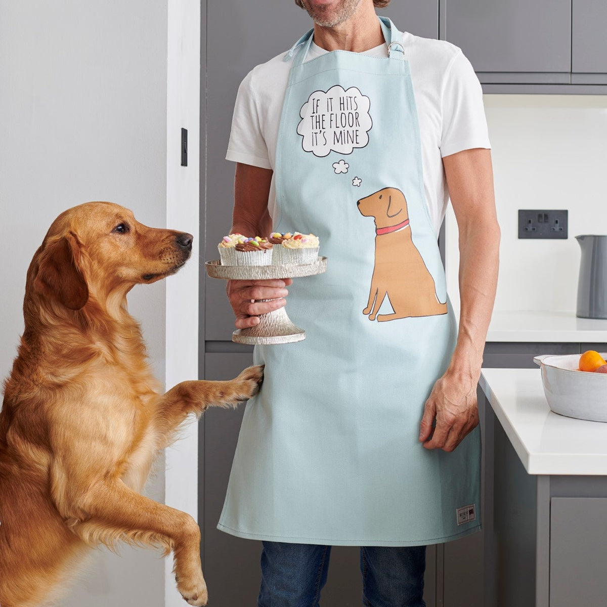 Fox Red Labrador apron featuring Cooper reaching for cake stand, with the playful design “If it hits the floor it’s mine” by Sweet William Designs