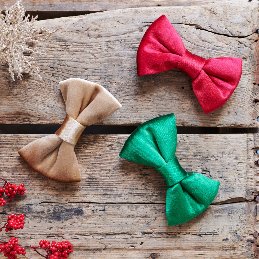 Our full collection of Christmas bow ties in rich red, festive green and warm gold velvet, beautifully arranged and perfect for gifting