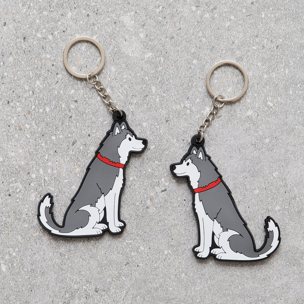 Husky and Alaskan Malamute keyring showing both sides — double-sided PVC design with Sweet William's classic illustration