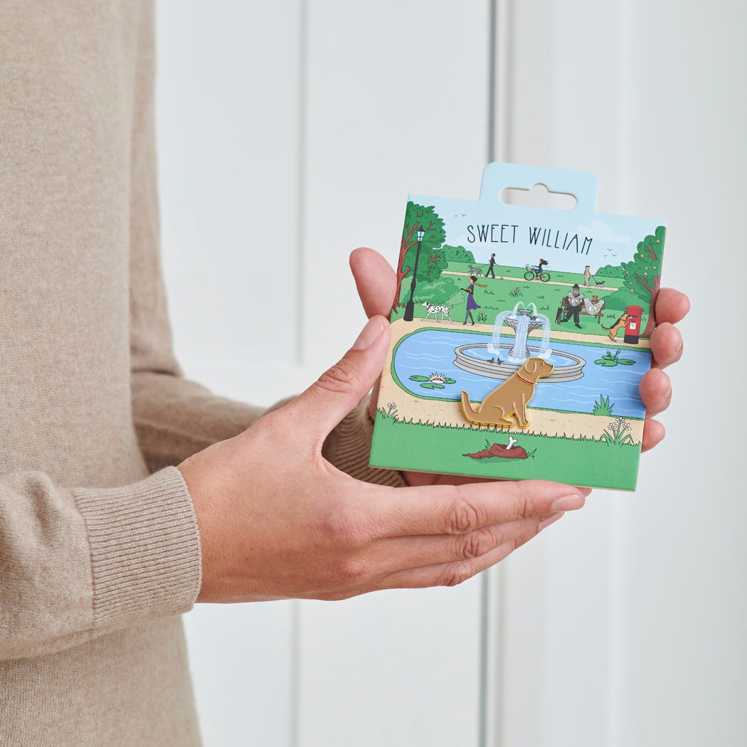 Golden Retriever enamel dog pin held in hands on illustrated park backing card — gold-plated dog lover gift by Sweet William Designs