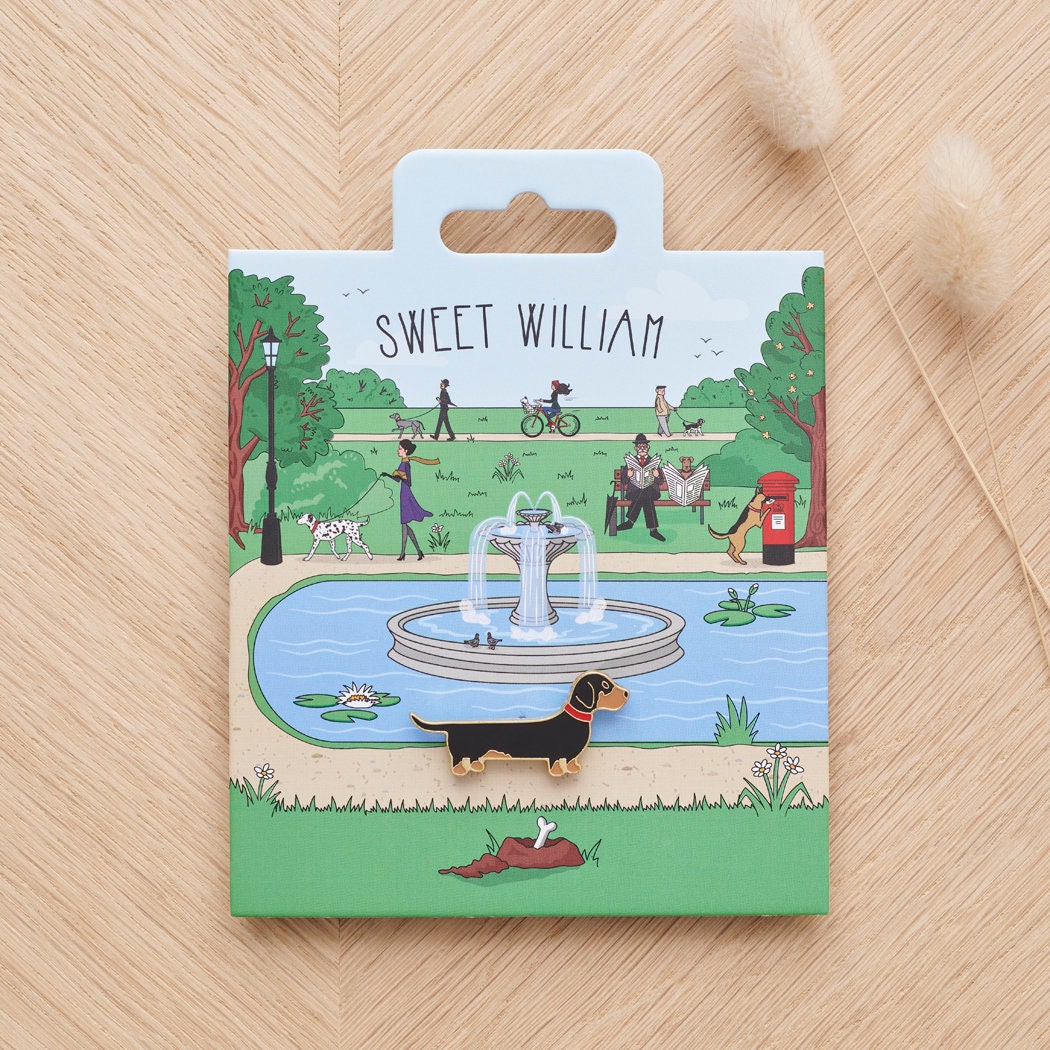 Dachshund enamel dog pin on Sweet William Designs park scene backing card — thoughtful gift for Dachshund lovers