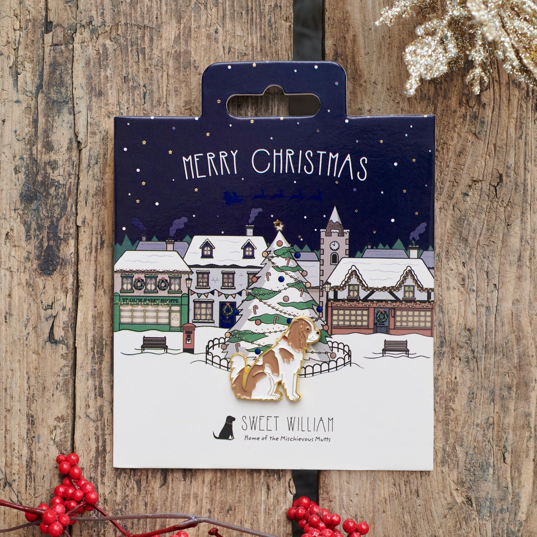 Cavalier King Charles Spaniel Christmas dog pin on festive village backing card — gold-plated enamel dog lover gift by Sweet William Designs