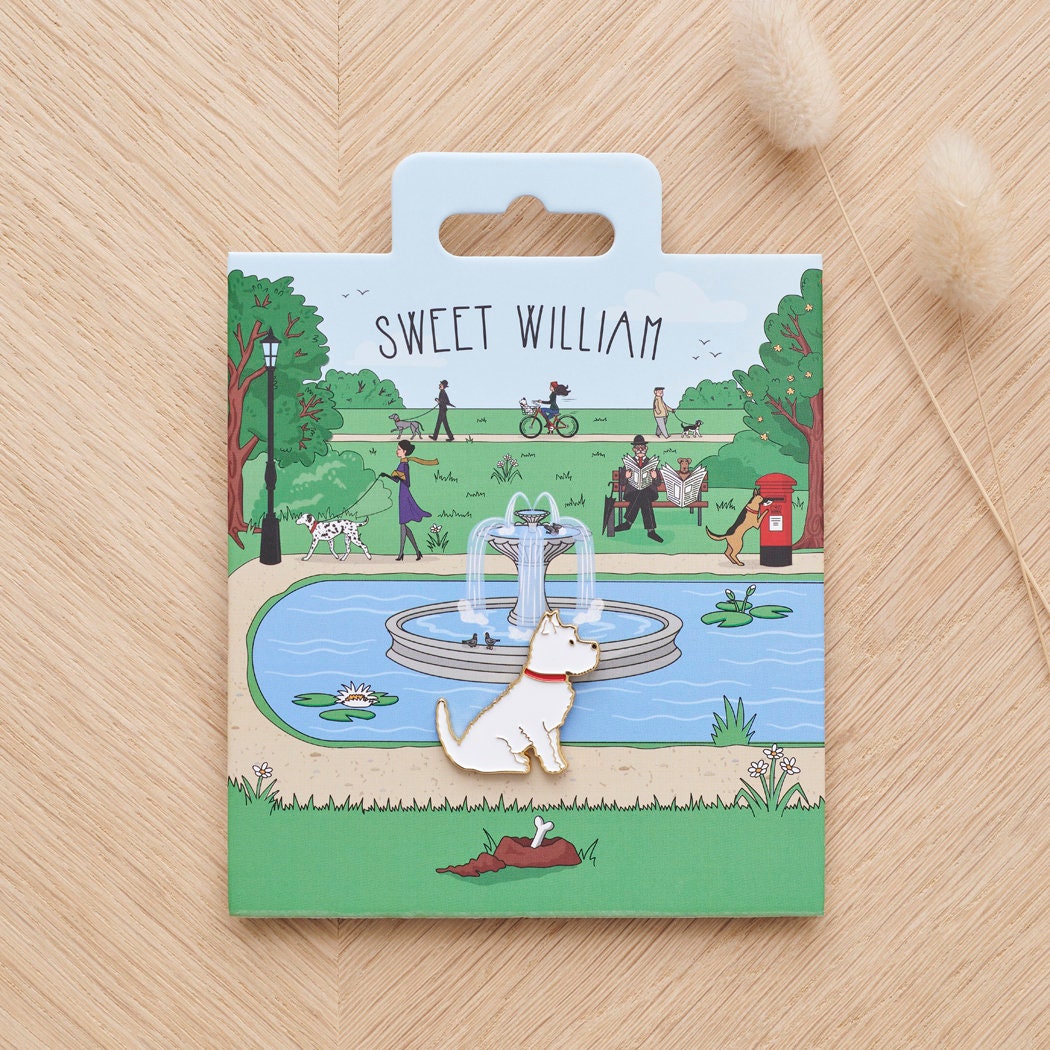 Westie enamel dog pin on Sweet William Designs park scene backing card — thoughtful gift for Westie lovers