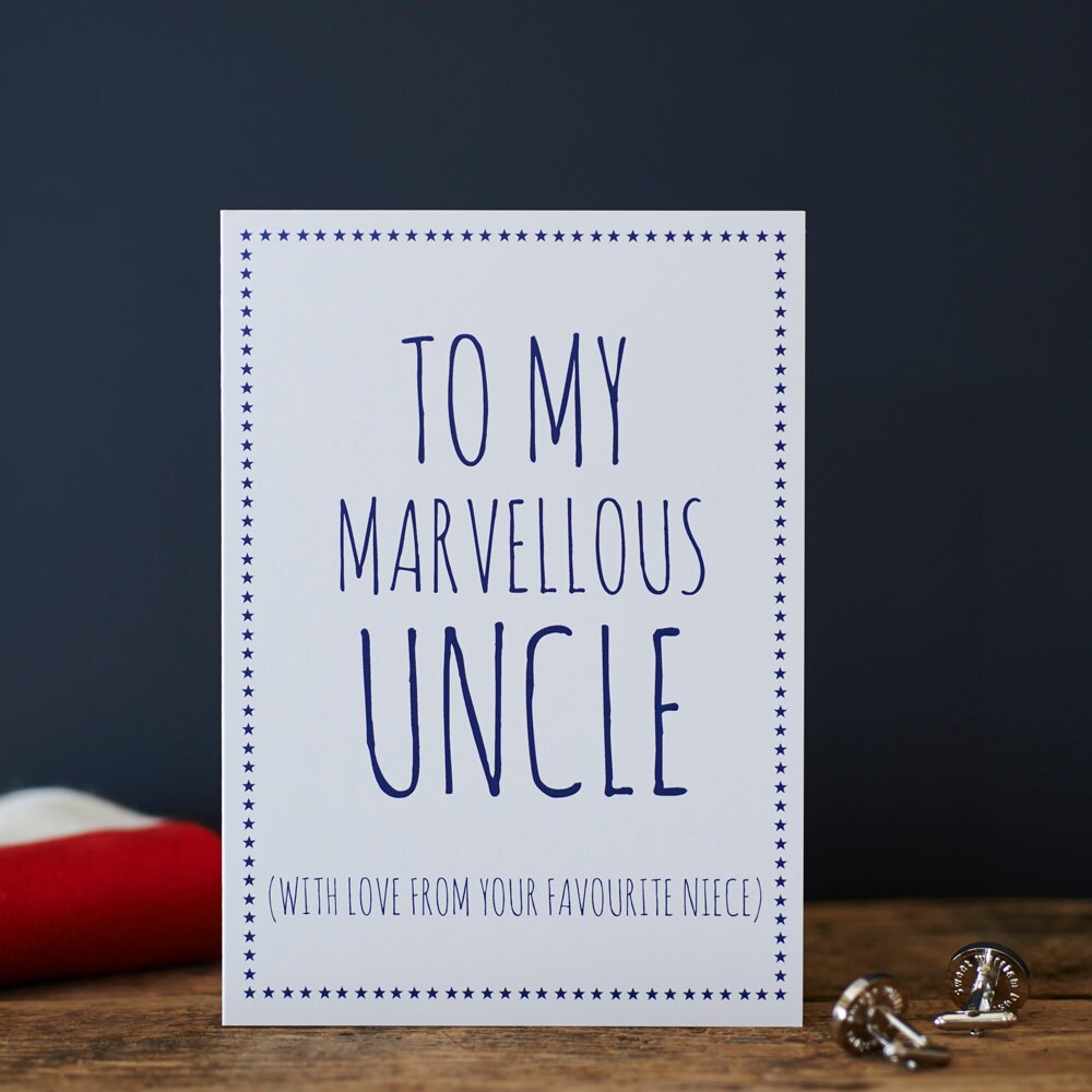 White Uncle card with blue lettering reading “To My Marvellous Uncle” and “With love from your favourite niece”, a blue star border and silver cufflinks beside it.