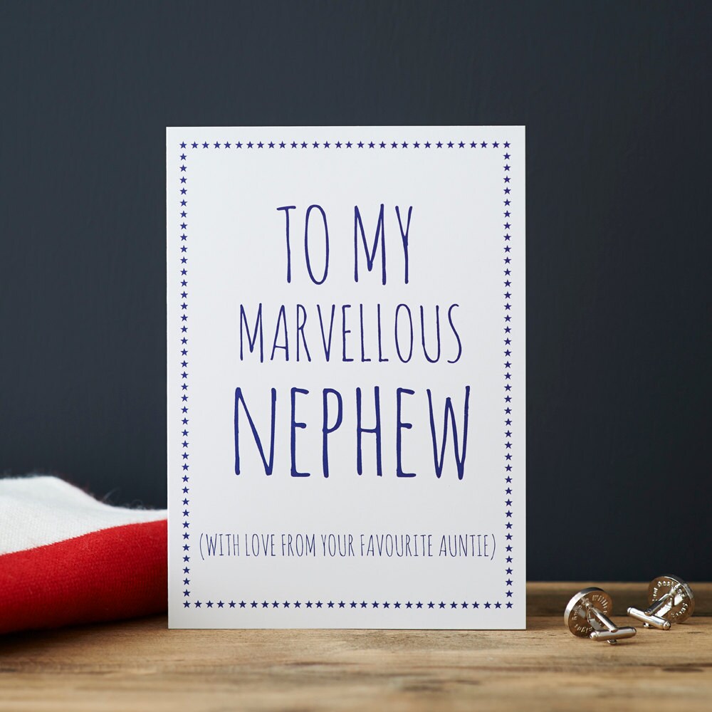 White Nephew card with blue lettering reading “To My Marvellous Nephew” and “With love from your favourite Auntie”, a blue star border and silver cufflinks beside it.