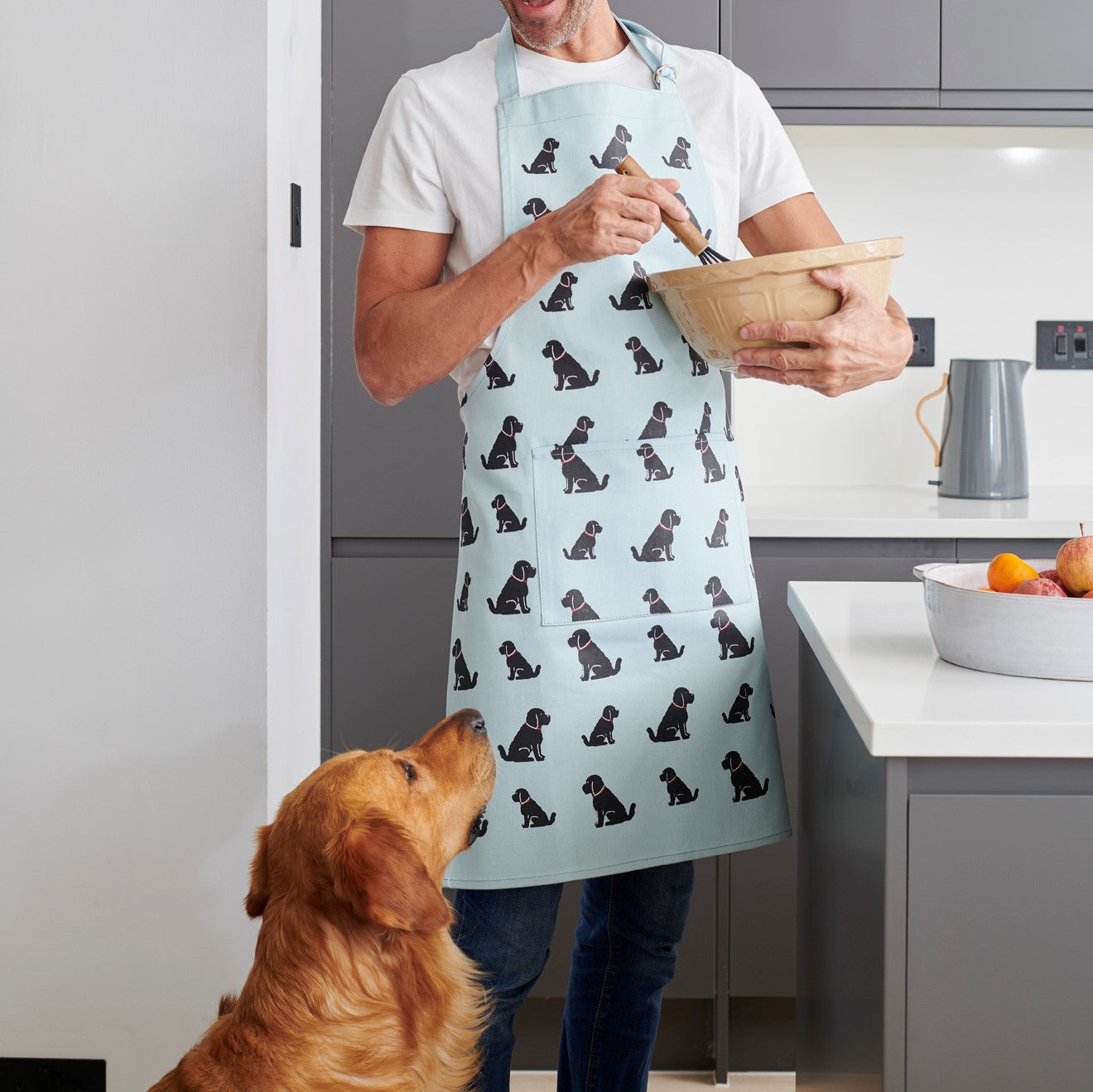 Black Cockapoo apron worn in the kitchen — organic cotton dog lover gift by Sweet William Designs