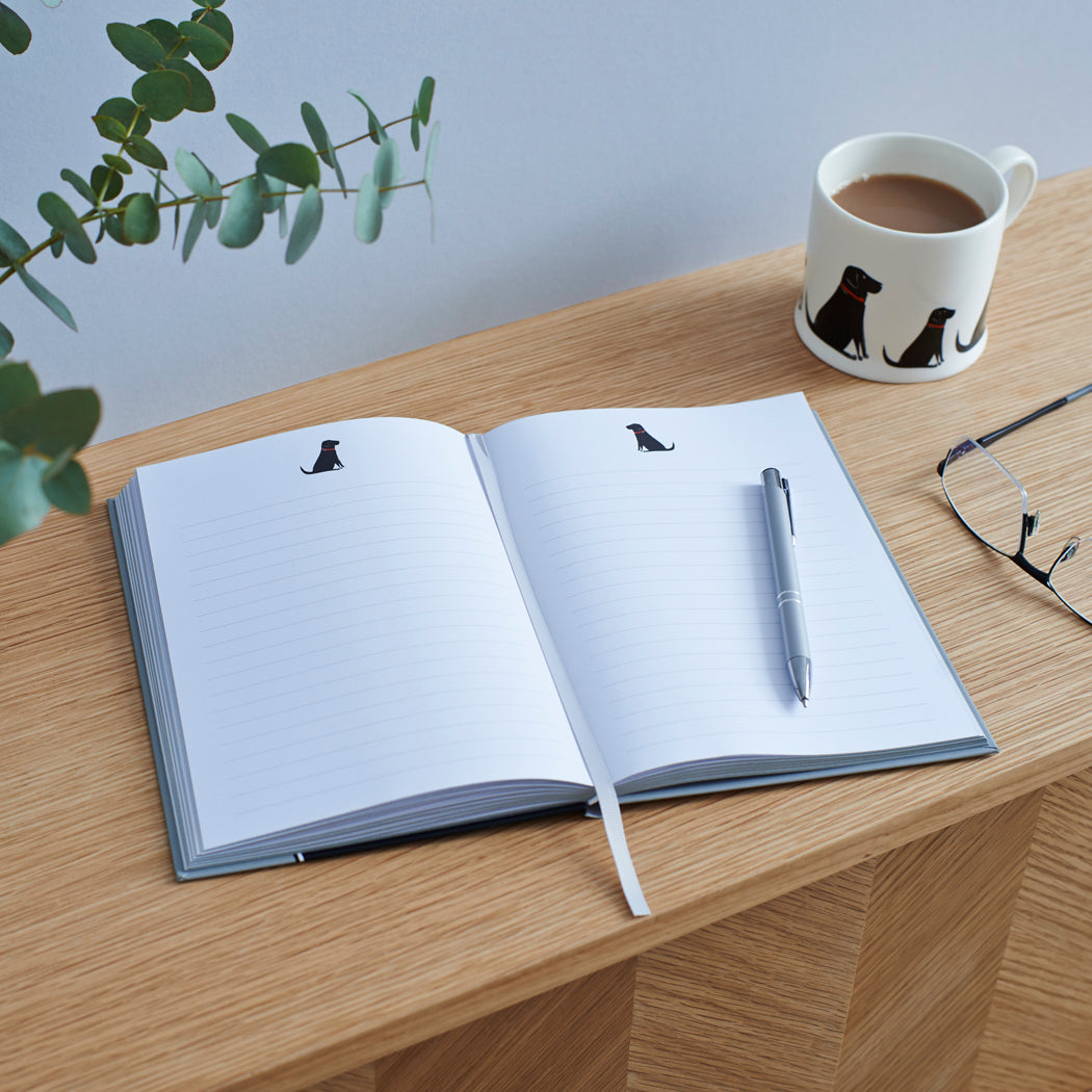 Black Labrador notebook open on desk — lined pages with Black Lab illustration, dog lover stationery gift