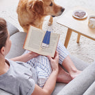 Woman reading a book with an Apricot Cockapoo / Labradoodle bookmark and matching Apricot Cockapoo / Labradoodle mug by Sweet William Designs