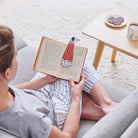 Woman reading a book with a Dalmatian bookmark and matching Dalmatian mug by Sweet William Designs