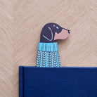 Dachshund bookmark peeking out of navy book — illustrated dog in blue jumper, vegan PU leather bookmark by Sweet William Designs