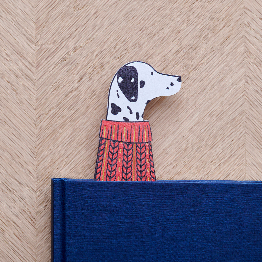 Dalmatian bookmark peeking out of navy book — illustrated dog in red jumper, vegan PU leather bookmark by Sweet William Designs