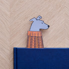 Lurcher bookmark peeking out of navy book — illustrated dog in orange jumper, vegan PU leather bookmark by Sweet William Designs