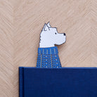 Westie bookmark peeking out of navy book — illustrated dog in blue jumper, vegan PU leather bookmark by Sweet William Designs