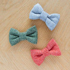 Green, grey and orange tweed dog bow ties displayed together, perfect for smart walks and special occasions