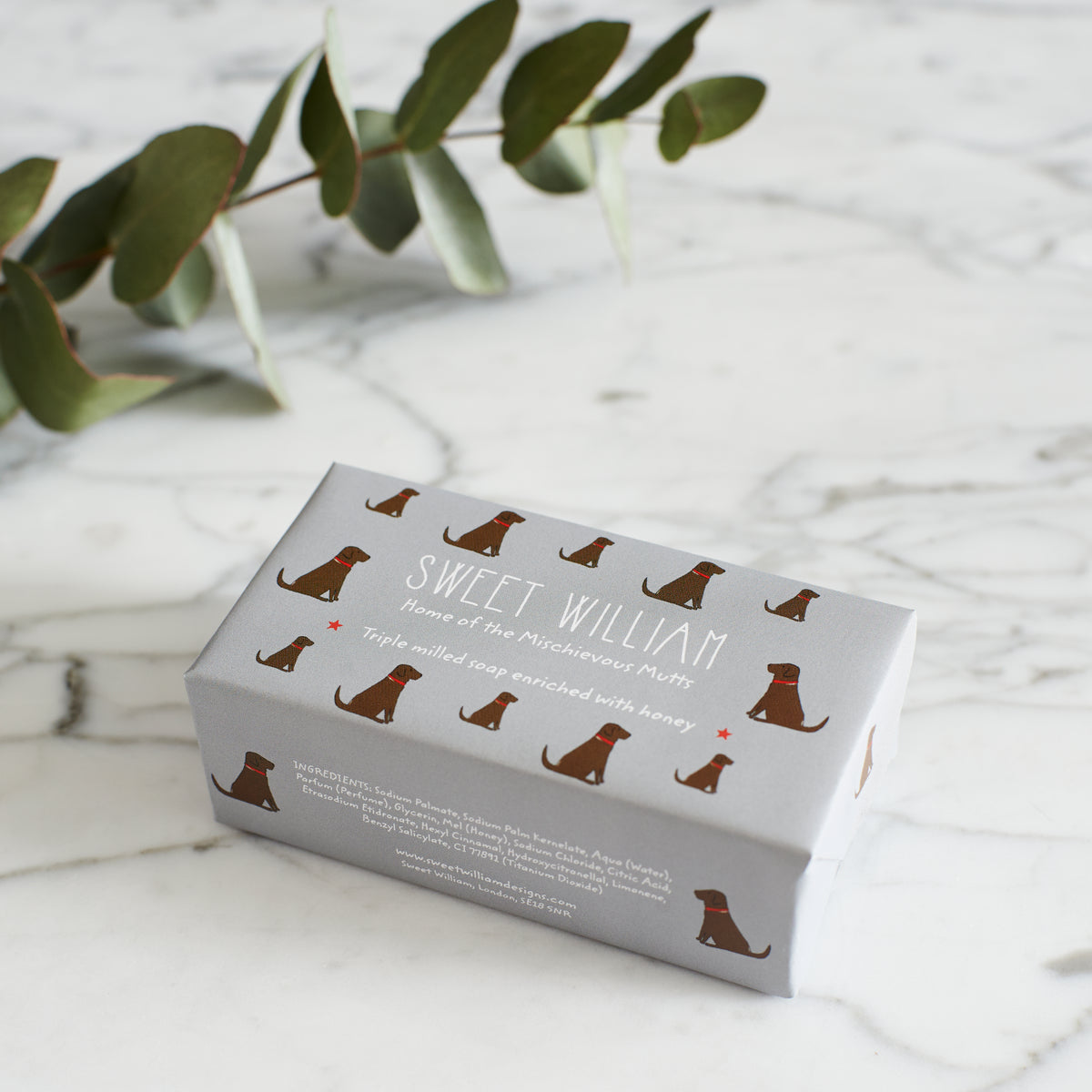 Chocolate Labrador triple milled soap on marble surface — honey-enriched luxury soap in Chocolate Labrador illustrated packaging by Sweet William Designs