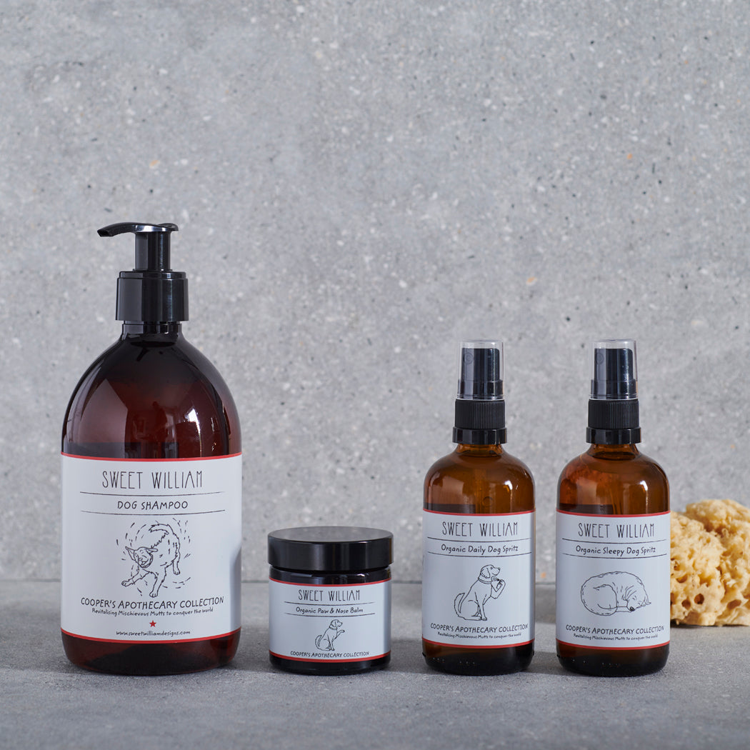 Sweet William Cooper’s Apothecary grooming collection with Organic Dog Paw & Nose Balm, dog shampoo and daily and sleepy dog spritzes