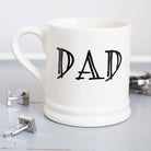 Simple ceramic Dad mug shown with cufflinks, a lovely everyday gift for Dad