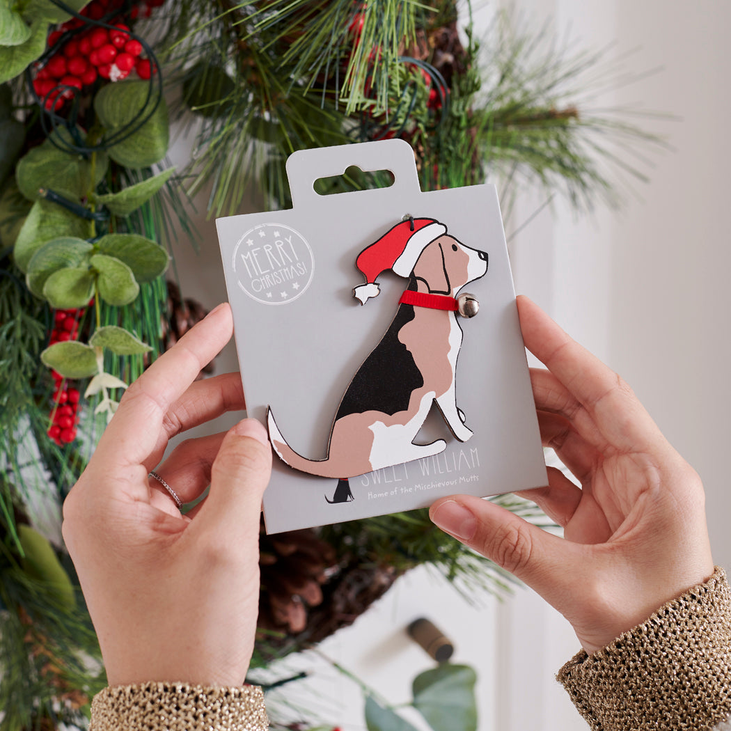 Beagle Christmas tree decoration held in hands on backing card — Father Christmas hat and jingle bell collar, dog lover gift by Sweet William Designs