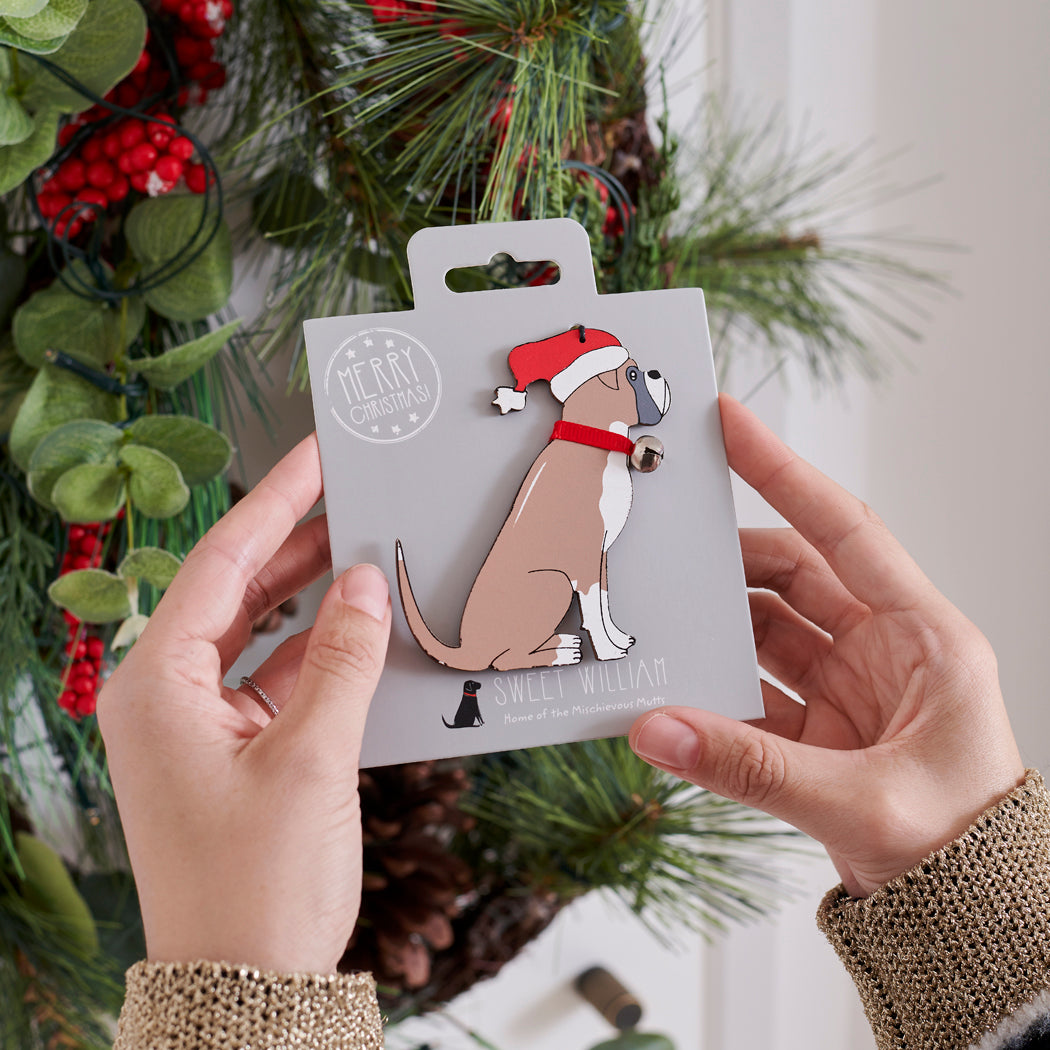 Boxer Christmas tree decoration held in hands on backing card — Father Christmas hat and jingle bell collar, dog lover gift by Sweet William Designs