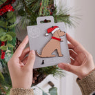 Golden Cocker Spaniel Christmas tree decoration held in hands on backing card — Father Christmas hat and jingle bell collar, dog lover gift by Sweet William Designs