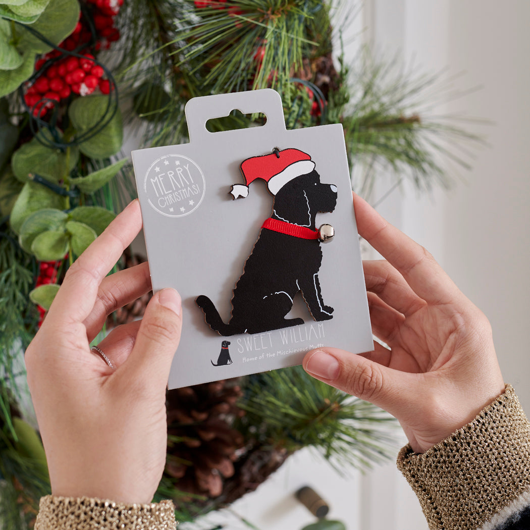 Black Cockapoo / Labradoodle Christmas tree decoration held in hands on backing card — Father Christmas hat and jingle bell collar, dog lover gift by Sweet William Designs
