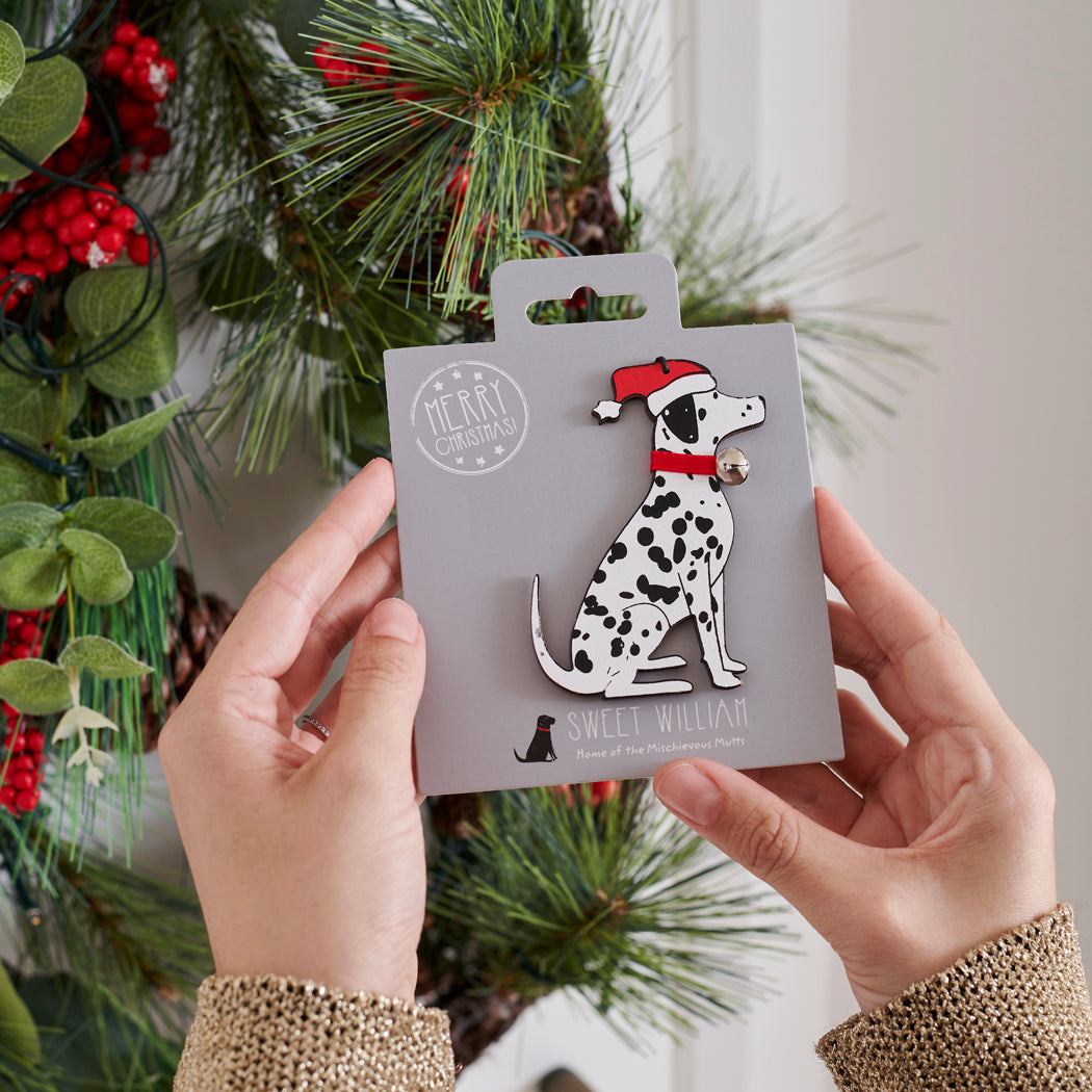 Dalmatian Christmas tree decoration held in hands on backing card — Father Christmas hat and jingle bell collar, dog lover gift by Sweet William Designs