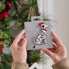 Dalmatian Christmas tree decoration held in hands on backing card — Father Christmas hat and jingle bell collar, dog lover gift by Sweet William Designs