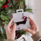 Dachshund Christmas tree decoration held in hands on backing card — Father Christmas hat and jingle bell collar, dog lover gift by Sweet William Designs