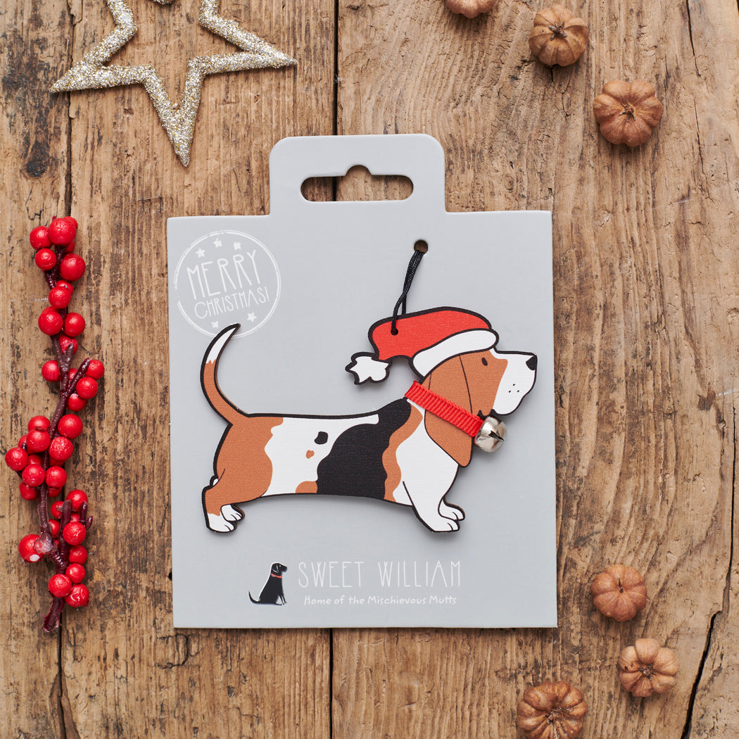 Basset Hound Christmas decoration on backing card — wooden dog decoration with Father Christmas hat and jingle bell collar, festive dog lover gift by Sweet William Designs