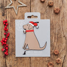 Chocolate Labrador Christmas decoration on backing card — wooden dog decoration with Father Christmas hat and jingle bell collar, festive dog lover gift by Sweet William Designs