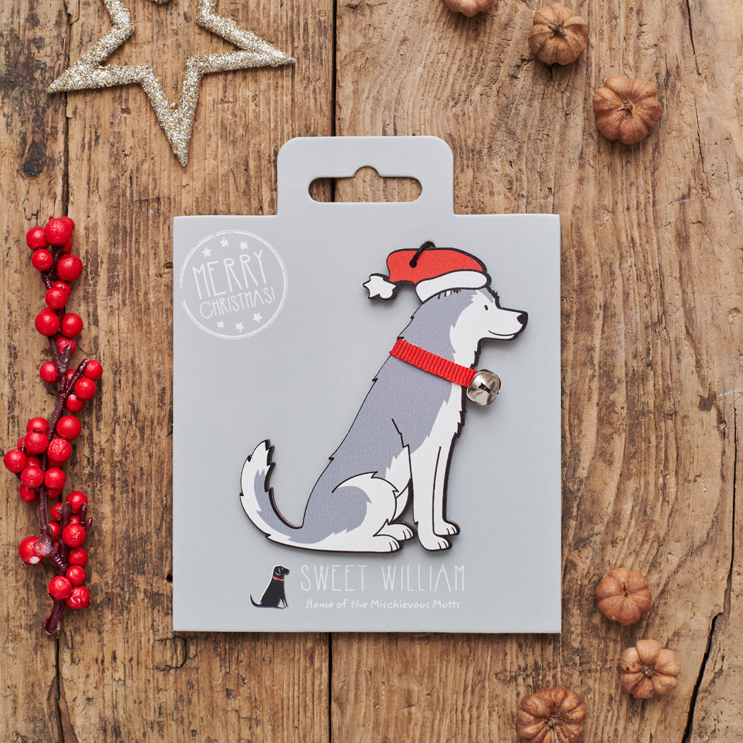 Husky Christmas decoration on backing card — wooden dog decoration with Father Christmas hat and jingle bell collar, festive dog lover gift by Sweet William Designs