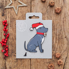 Staffie Christmas decoration on backing card — wooden dog decoration with Father Christmas hat and jingle bell collar, festive dog lover gift by Sweet William Designs