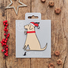 Yellow Labrador Christmas decoration on backing card — wooden dog decoration with Father Christmas hat and jingle bell collar, festive dog lover gift by Sweet William Designs