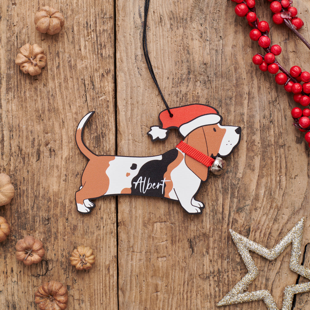 Personalised Basset Hound Christmas decoration with name — wooden dog decoration with Father Christmas hat and jingle bell collar, thoughtful dog lover gift by Sweet William Designs